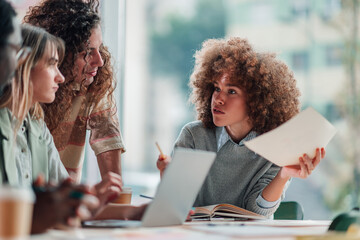 Diverse team collaborating during a business meeting in office
