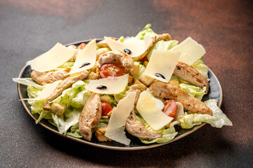 Classic chicken caesar salad with parmesan shavings
