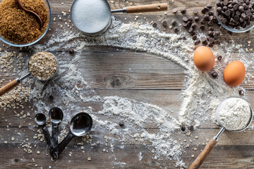 A baking concept image with scattered ingredients and copy space in the middle.