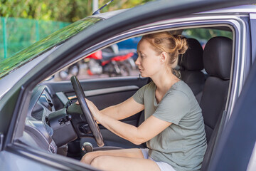 Woman cleaning her car, organizing seats and removing clutter to keep the vehicle tidy. Auto care, cleanliness and everyday routine concept, representing responsibility, order and modern lifestyle