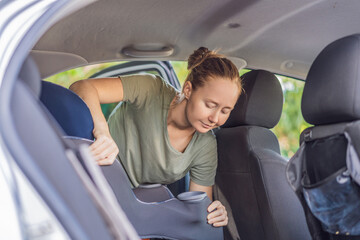 Woman cleaning her car, organizing seats and removing clutter to keep the vehicle tidy. Auto care, cleanliness and everyday routine concept, representing responsibility, order and modern lifestyle