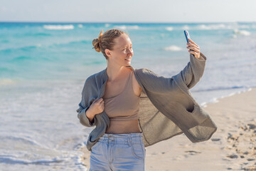 Woman enjoying peaceful time at the beach, relaxing on the sand with ocean views and warm sunlight. Summer leisure, wellbeing and travel concept, representing freedom, calmness and mindful coastal