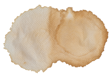 Macro shot of a large, dried coffee stain on a textured white paper napkin