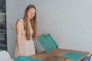 Woman enjoying a peaceful breakfast at the table in a bright home interior, starting her morning with calm energy. Healthy lifestyle, morning routine and wellbeing concept, representing self-care