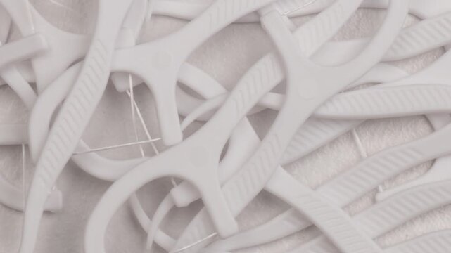 white dental floss picks, rotation in circle. oral care tool, Turning. selective focus. clean hygiene product