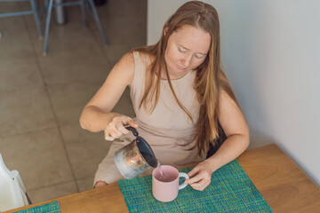 Woman enjoying a peaceful breakfast at the table in a bright home interior, starting her morning with calm energy. Healthy lifestyle, morning routine and wellbeing concept, representing self-care