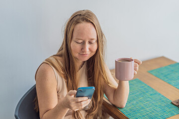 Woman enjoying a peaceful breakfast at the table in a bright home interior, starting her morning with calm energy. Healthy lifestyle, morning routine and wellbeing concept, representing self-care