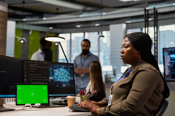 Admin writing code snippets on chroma key tablet in modern office, adjusting program configurations. Woman running diagnostic tools app on isolated screen device, monitoring API cloud services