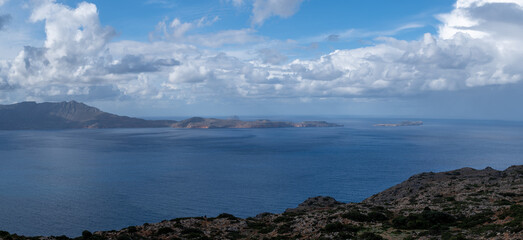 Panoramic View of Coastal Islands Under Dramatic Cloudy Sky