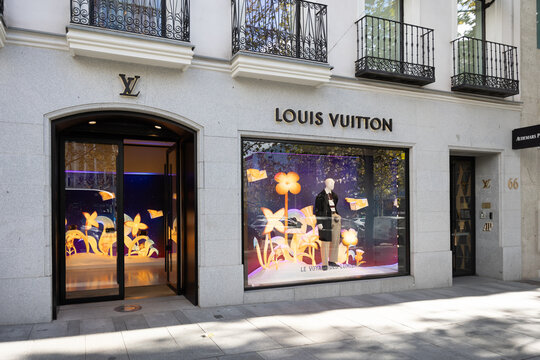 Madrid, spain; 11 05 2025 louis vuitton boutique storefront showing seasonal window display