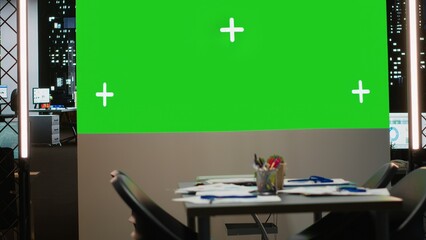 Empty boardroom with a digital copy space projection for a late night session focused on growth strategy, report analysis and multinational project alignment. High tech workspace.