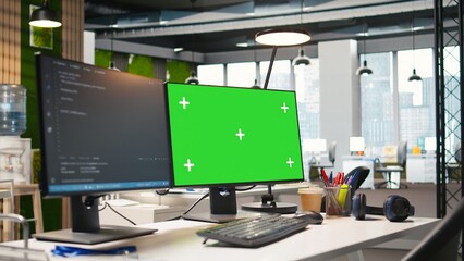 Green screen computer display in modern startup office displaying code snippets in various programming languages used for software development. Chroma key PC in empty software agency workplace