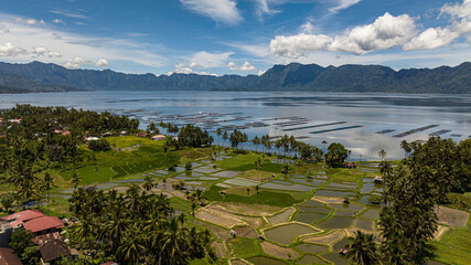 Village among rice fields and farmland. Lake Maninjau. Sumatra, Indonesia.
