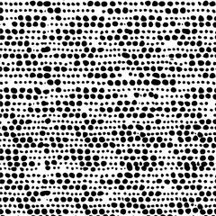 Abstract black and white pattern featuring bold hand-drawn graphic elements.