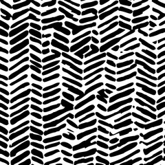 Bold artistic pattern made with hand-drawn marks and expressive black strokes.