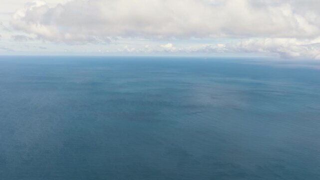 Blue sky with clouds over sea. Open blue ocean. Indonesia.