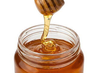 Golden Honey Dripping from a Wooden Dipper into a Glass Jar Captured Beautifully