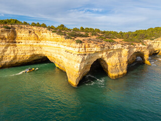 Benagil Cave, Tour Boat, Cliffs and Atlantic Ocean on Sunny Day. Drone Shot. Algarve, Portugal
