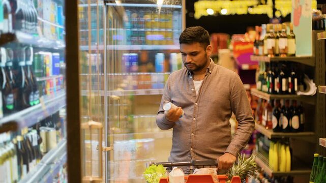 Indian man shopping for groceries in supermarket