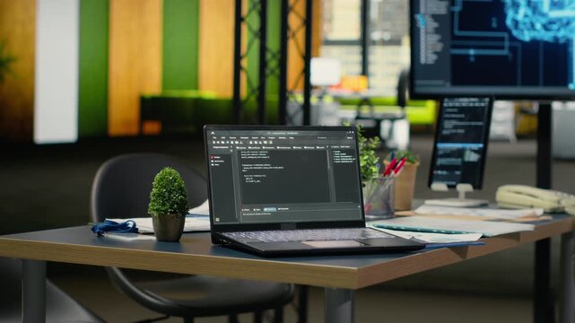 Software running on laptop in empty office to accelerate artificial intelligence calculations. Close up of programming language script on notebook used for deep learning training datasets systems