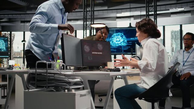 Scared admins in office panicked by alert, trying to stop hacker intrusion stealing sensitive data. Startup coworkers doing frantic incident response to network attack from cybercriminal, camera A