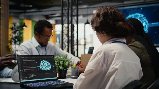 Programmers in office using specialized technology to accelerate complex AI calculations. IT workers managing neural network training datasets with notebook device, camera A