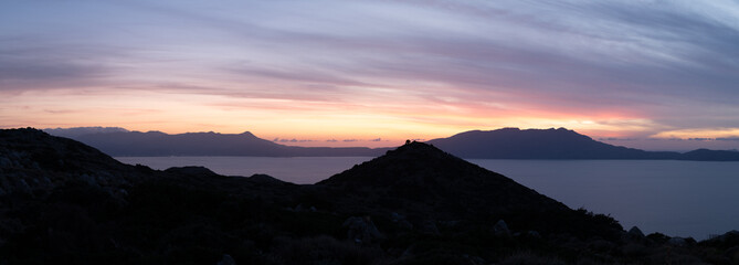 Serene Coastal Sunset Panorama Over Crete Mountains and Sea