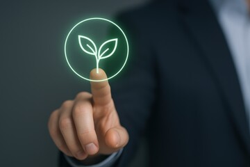 Digital sustainability concept: Businessman touches green plant icon on screen interface, representing eco-friendly technology