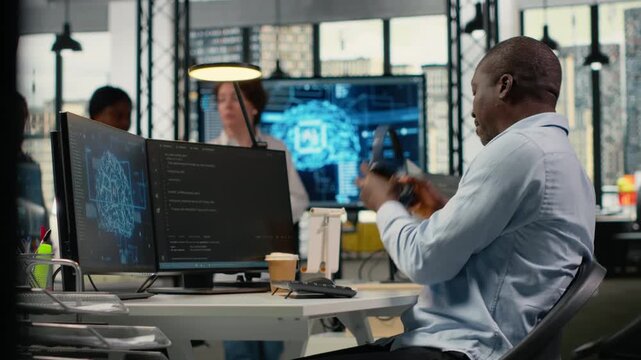 Technician listening music in office, using specialized hardware to accelerate complex AI calculations. IT expert wearing audio headphones managing machine learning training datasets, camera B