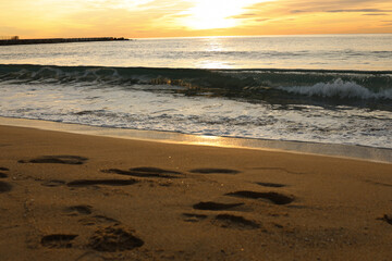 Beautiful calm sea on a sunny day. Sea light surf shot close-up.
