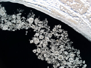 Bird's-eye view of ice floes drifting on a river © Martin