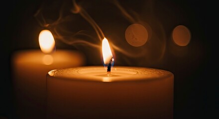 Close-up of Lit Candles with Soft Smoke and Bokeh
