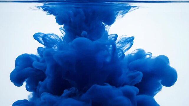 Blue cloud expanding in water