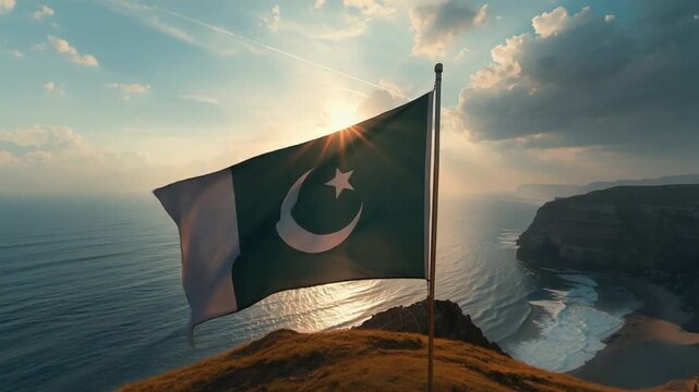 Pakistan Flag Waving Over Ocean Cliff at Sunrise &ndash; Pakistan Day Scenic Footage