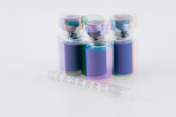 Multiple Exposure Photo of Glass Vials with Various Color Labels