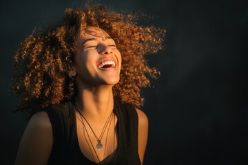 Naklejka premium Joyful Curly Woman in Casual Attire, Laughing and Shaking Head Against Backlight in Canada