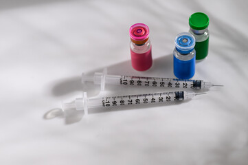 Close up of Glass Vials with Single Use Syringes