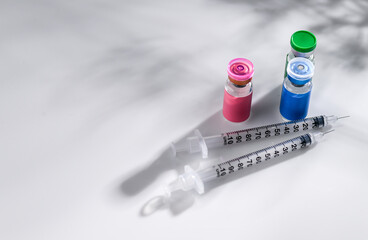 Close up of Glass Vials with Single Use Syringes