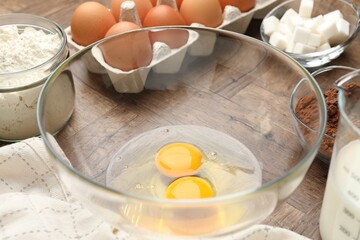 Different ingredients for dough on wooden table, closeup