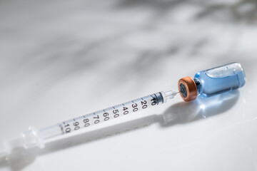 Close up of Glass Vial with Single Use Syringe