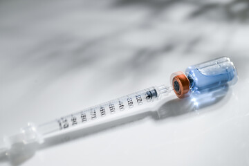 Close up of Glass Vial with Single Use Syringe