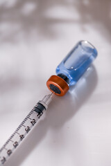 Close up of Glass Vial with Single Use Syringe