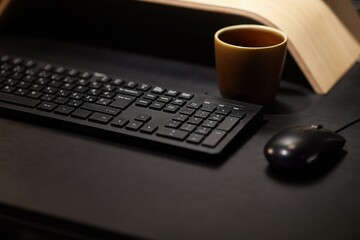 Computer desk keyboard and mouse at night