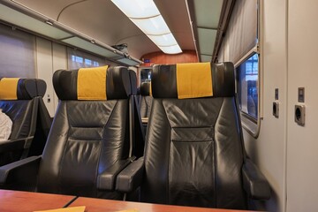 Train trip window view and empty seats