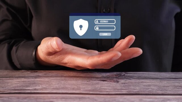Close-up of a woman's hand on a table holding a login animation