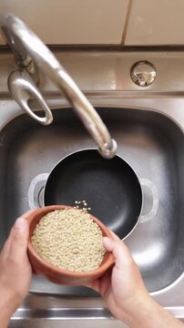 adding lentils to an empty pot