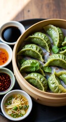 Steamed dumplings, vibrant green, served with flavorful sauces, in a bamboo steamer.