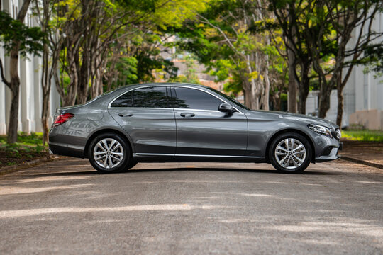 Grey Mercedes Benz C180 side profile view, Luxury sedan parked on street