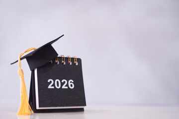 Study goals, 2026 Desk calendar with graduation hat. The concept for Resolution, Goal, Action, Planning, and manage time to success graduate.