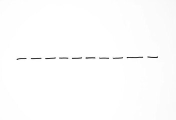 A hand-drawn, irregular dashed squiggly line, black ink on white, dashed line,  whimsical